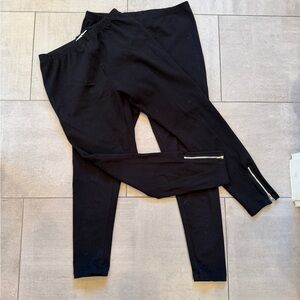 2 pair of Black Leggings: 1 w fun zipper detail, other pair plain. Both MPetite